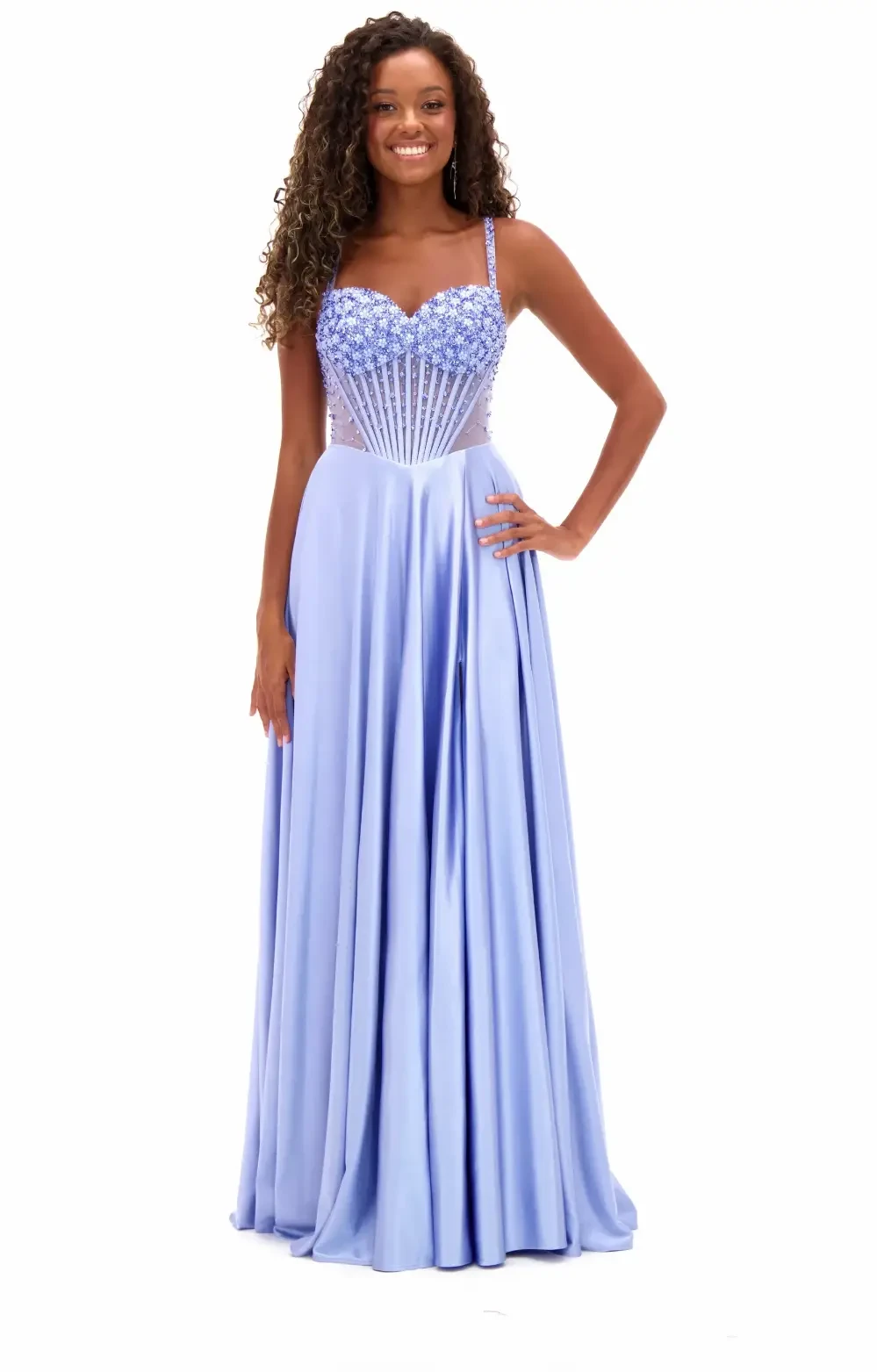 Model wearing a white gown by Candy Prom